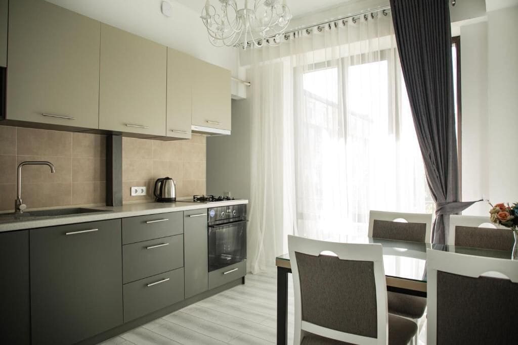 Deluxe Apartment, 2 Bedrooms | Private kitchen | Full-size fridge, microwave, oven, coffee/tea maker