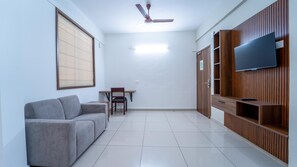 Superior Room with Grand Living Room | Desk, iron/ironing board, free WiFi, bed sheets - Treebo Petals Suites Marine Drive (Kanayannur)