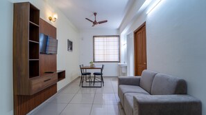 Deluxe Suite with Living Room | Desk, iron/ironing board, free WiFi, bed sheets - Treebo Petals Suites Marine Drive (Kanayannur)