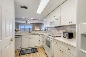 Condo, 2 Bedrooms | Private kitchen | Fridge, microwave, coffee/tea maker, toaster - Seacrest 610 Is A 2 Br Gulfside On Okaloosa Island 2 Bedroom Condo by RedAwning (Fort Walton Beach)