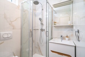 Shower, hair dryer, towels, soap