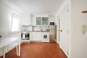 Fridge, microwave, cookware/dishes/utensils, dining tables