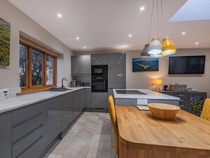 Dishwasher, highchair - 1 bedroom accommodation in Penrhos Feilw, near Trearddur Bay (Penrhos Feilw, near Trearddur Bay)