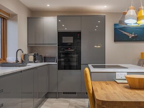 Dishwasher, highchair - 1 bedroom accommodation in Penrhos Feilw, near Trearddur Bay (Penrhos Feilw, near Trearddur Bay)