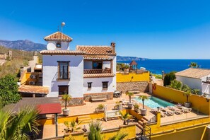 A coastal villa with a swimming pool, a small tower, and a view of the sea. - Villa Benizan Private Pool, Sea Views, A/C, WiFi (Torrox)