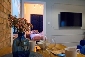 Exclusive Apartment | Living area | Flat-screen TV