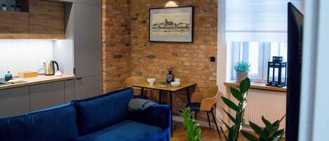 Exclusive Apartment | Living area | Flat-screen TV