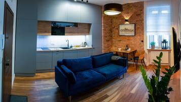 Exclusive Apartment | Living area | Flat-screen TV