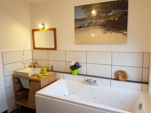 Combined shower/bathtub, jetted bath, hair dryer, soap