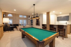 Flat-screen TV, fireplace, video games, DVD player