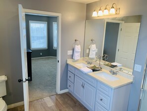 Bathtub, hair dryer, towels, soap