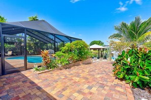 Outdoor pool, a heated pool - Waterfront oasis with private heated & screened pool, dock w/boat lift. 3BR/2BA (Apollo Beach)