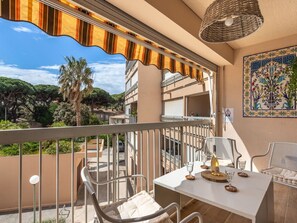 Enjoy dining or socializing on the balcony with a view of the surrounding residential area.