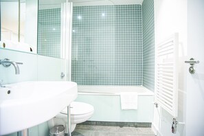 Bathtub, hair dryer, bidet, towels