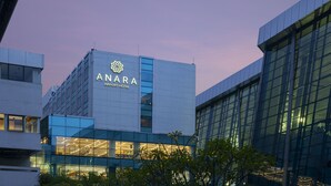 A modern building with a sign reading "ANARA AIRPORT HOTEL". - Anara Airport Hotel (Tangerang)