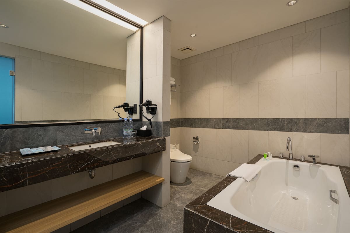 junior suite | premium bedding, minibar, desk, blackout curtains