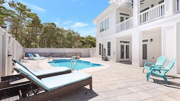 A heated pool, pool loungers