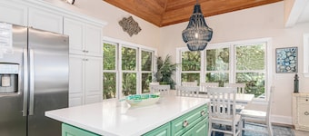 Enjoy this golf course view home from the screened in porch; recently renovated floors