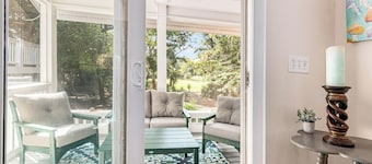 Enjoy this golf course view home from the screened in porch; recently renovated floors
