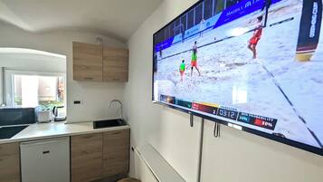 Fridge, microwave, stovetop, coffee/tea maker