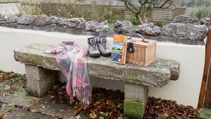 A stone bench with a blanket, a pair of shoes, a wicker basket, and a book. - Ingleton 2-bed Cottage, Sleeps 4, Pet Ok & Parking (Carnforth)
