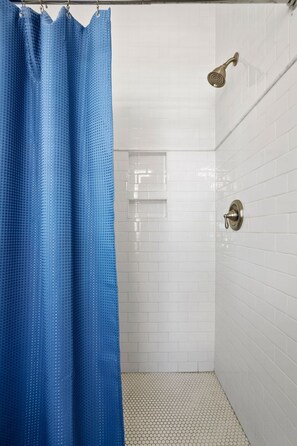 Shower, hair dryer, towels, shampoo