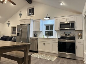 Coffee/tea maker, fridge, microwave, oven