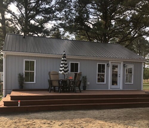 Newly renovated water view cottage nestled in the pines.