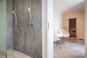 Shower, hair dryer, towels, soap
