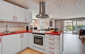 Fridge, stovetop, dishwasher, coffee/tea maker