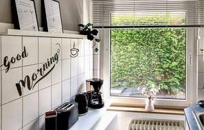 Fridge, stovetop, coffee/tea maker, cookware/dishes/utensils