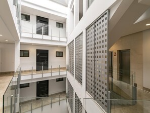 Experience the open layout and modern design of this multi-level space, featuring large windows and glass railings.