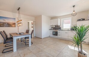 Fridge, stovetop, dishwasher, coffee/tea maker