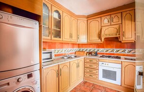 Fridge, microwave, stovetop, cookware/dishes/utensils