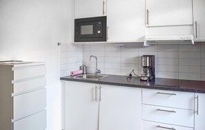 Fridge, microwave, stovetop, coffee/tea maker