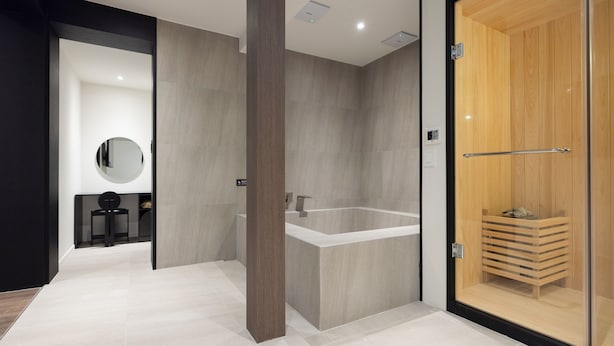 A modern bathroom with a freestanding bathtub, a wooden vanity, and a glass-enclosed shower area. - Anook Hotel and Spa Daejeon Yuseong (Daejeon)