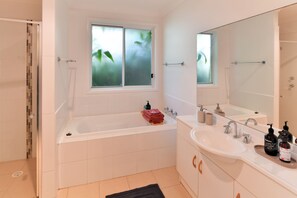 Bathtub, hair dryer, towels, soap