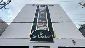 The exterior of Den Basta hotel with a prominent sign indicating it is open. - Busan Deokcheon Den Basta Hotel (Busan)