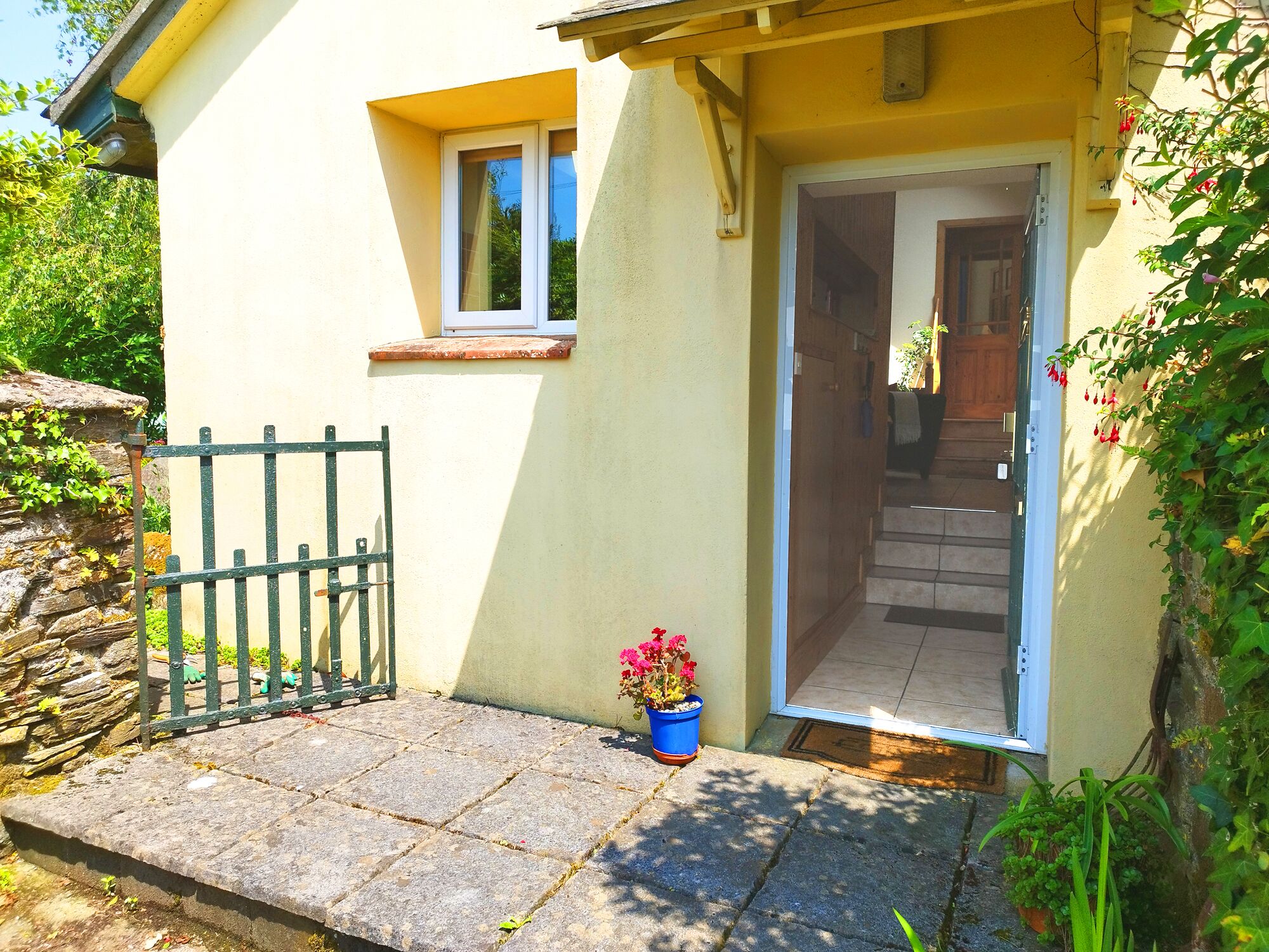Front door opens to private patio and gate leads to courtyard garden