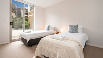 2 bedrooms, travel crib, WiFi, bed sheets