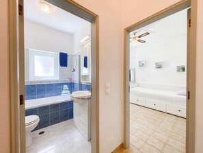 Bathtub, hair dryer, towels