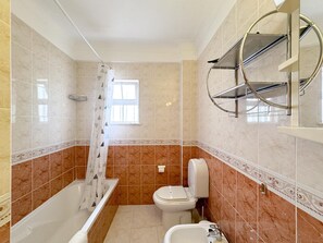 Bathtub, hair dryer, towels