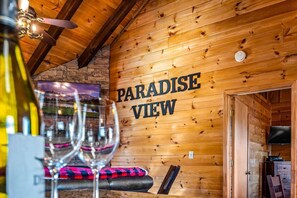 A wooden interior with a sign reading "PARADISE VIEW".