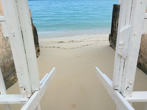 Beach front apartment with garden and direct access to a private   beach and