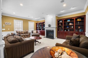 TV, fireplace, books, offices