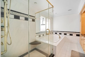 Combined shower/tub, hair dryer, towels, soap