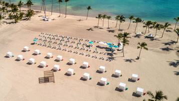 Private beach, white sand, sun loungers, beach umbrellas