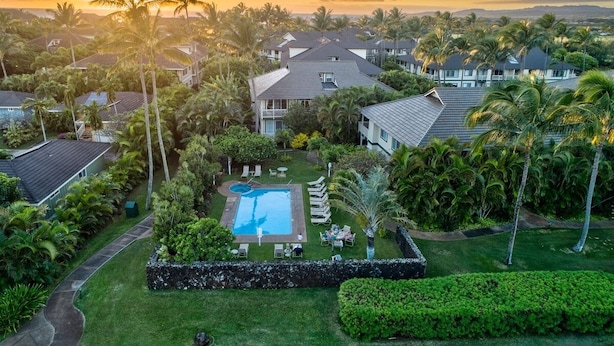 A residential area with houses, a swimming pool, and palm trees. - 3BR condo with A/C, pool & 10min walk to the beach! (Koloa)