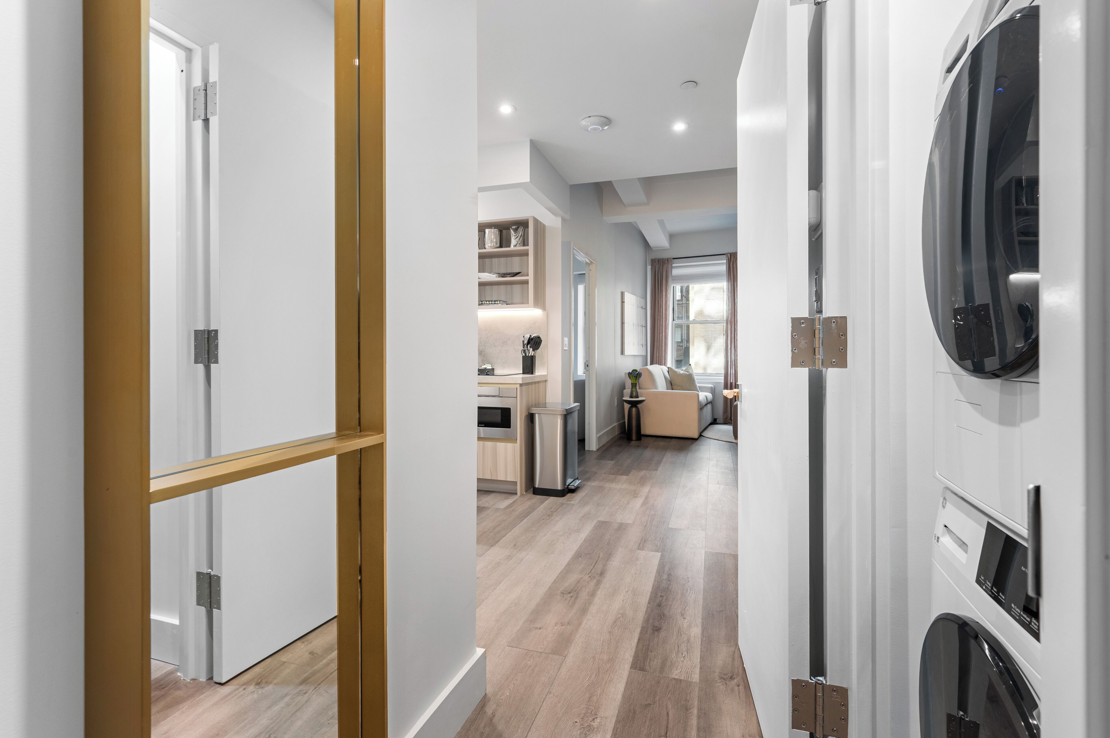 A modern kitchen with a built-in oven, a sink, and a countertop.