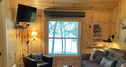 Escape to cozy, secluded lakefront cabin in the north woods